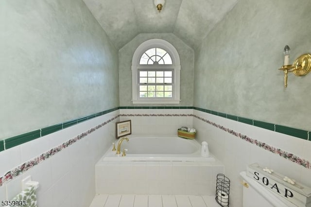 777 E Ridgewood Ave, Ridgewood Village, NJ 07450 - bathroom with a garden tub, toilet, and vaulted ceiling