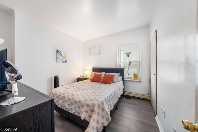 857 Garden St, Elizabeth City, NJ 07202 - bedroom with a baseboard radiator, wood finished floors, and baseboards