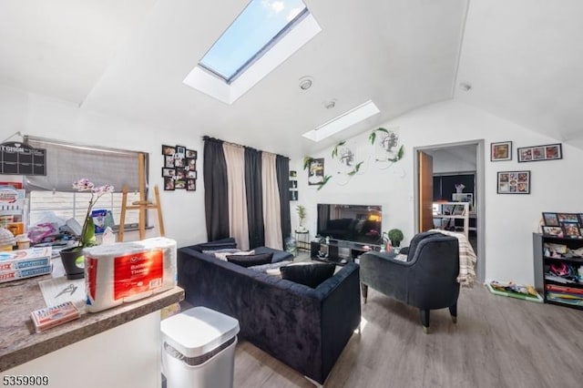 857 Garden St, Elizabeth City, NJ 07202 - living room featuring vaulted ceiling, a skylight, and wood finished floors