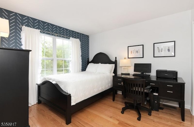 14 Coolidge Way, Montgomery Twp, NJ 08540 - bedroom featuring an accent wall, wallpapered walls, wood finished floors, and an office area