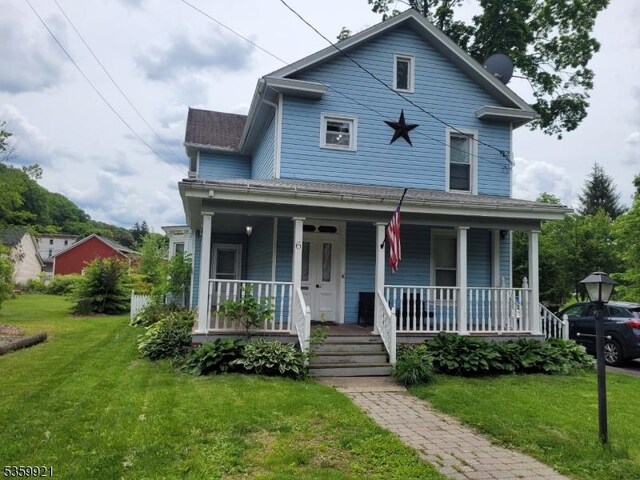 6 Charles St, Knowlton Twp, NJ 07840 - view of front of home featuring a porch and a front lawn