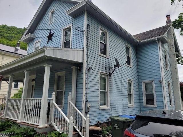 6 Charles St, Knowlton Twp, NJ 07840 - view of home's exterior with a porch and a chimney