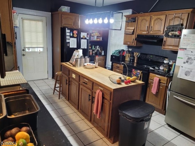 6 Charles St, Knowlton Twp, NJ 07840 - kitchen with black appliances, butcher block countertops, light tile patterned floors, ventilation hood, and a kitchen island