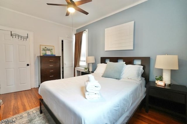 680 N 8th St, Newark City, NJ 07107 - bedroom with wood finished floors, ornamental molding, and a ceiling fan