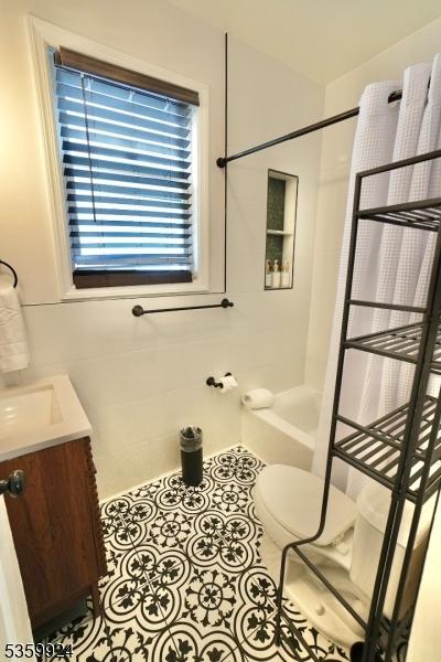 680 N 8th St, Newark City, NJ 07107 - full bath featuring vanity, washtub / shower combination, and tile patterned flooring
