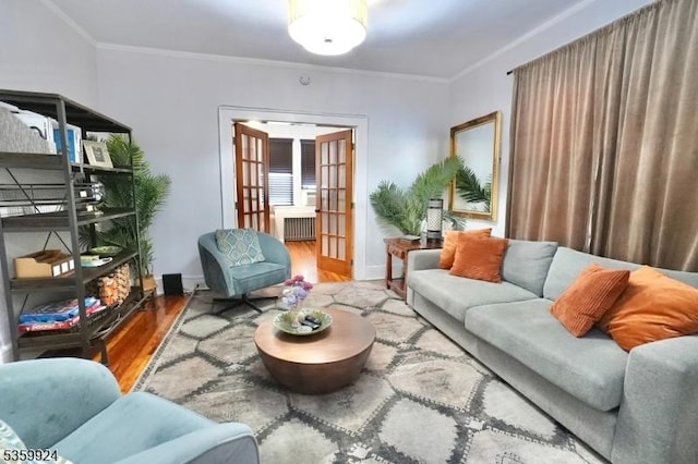 680 N 8th St, Newark City, NJ 07107 - living area with wood finished floors, radiator heating unit, and ornamental molding