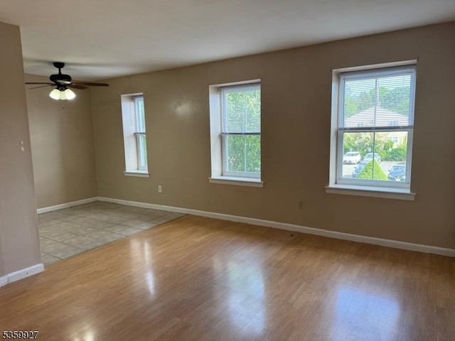 1001 Unicorn Way Unit D2, Clifton City, NJ 07011 - empty room featuring plenty of natural light, light wood-style floors, baseboards, and a ceiling fan