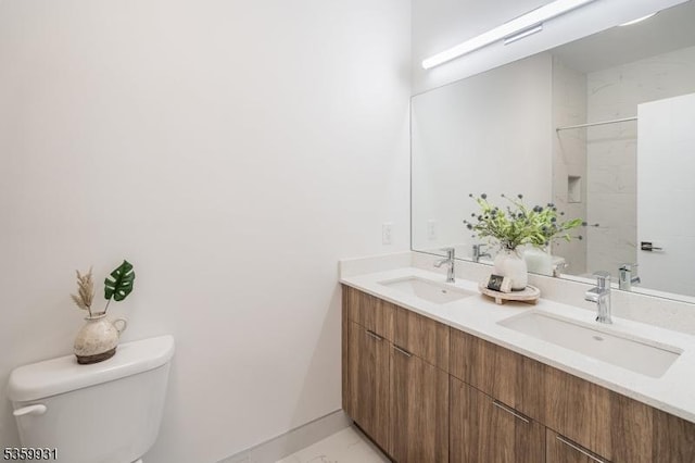 27 Leonard St Unit 2, Jersey City, NJ 07307 - bathroom with double vanity, marble look tile flooring, and a shower
