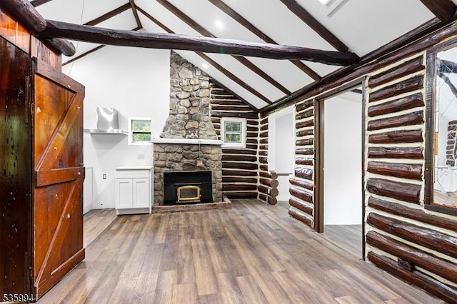 13 Alturas Rd, Vernon Twp, NJ 07422 - unfurnished living room with wood finished floors, beamed ceiling, high vaulted ceiling, and a fireplace