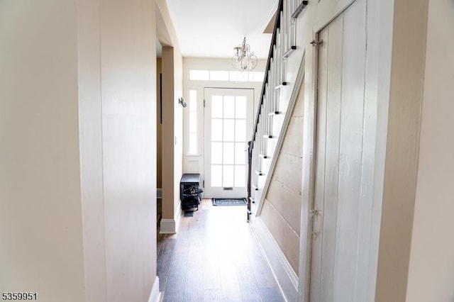 61 Park Ave, Flemington Boro, NJ 08822 - corridor with stairway, wood finished floors, and a chandelier