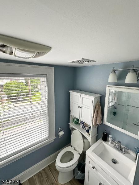 61 Park Ave, Flemington Boro, NJ 08822 - bathroom featuring wood finished floors and vanity