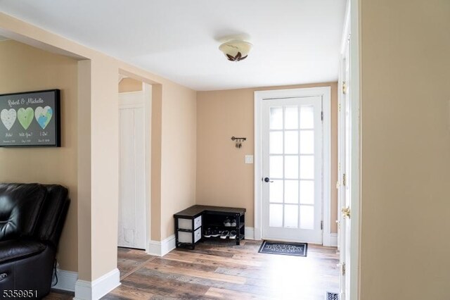 61 Park Ave, Flemington Boro, NJ 08822 - doorway to outside featuring wood finished floors and baseboards