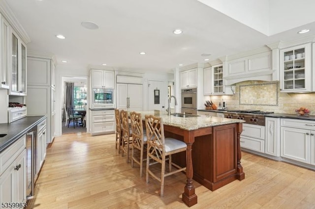 23 Parkview Rd, Chatham Twp, NJ 07928 - kitchen with appliances with stainless steel finishes, a sink, light wood-style floors, tasteful backsplash, and recessed lighting