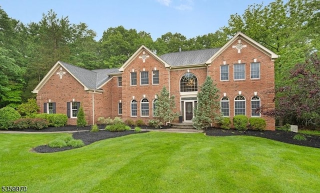 9 Oakridge Rd, Clinton Twp, NJ 08801 - colonial inspired home featuring a front yard and brick siding