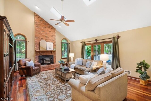 9 Oakridge Rd, Clinton Twp, NJ 08801 - living area featuring high vaulted ceiling, wood finished floors, a ceiling fan, a skylight, and baseboards