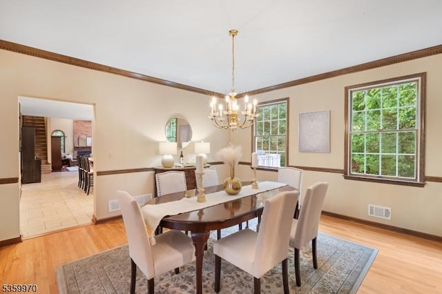 9 Oakridge Rd, Clinton Twp, NJ 08801 - dining area featuring light wood-style floors, a chandelier, crown molding, and baseboards