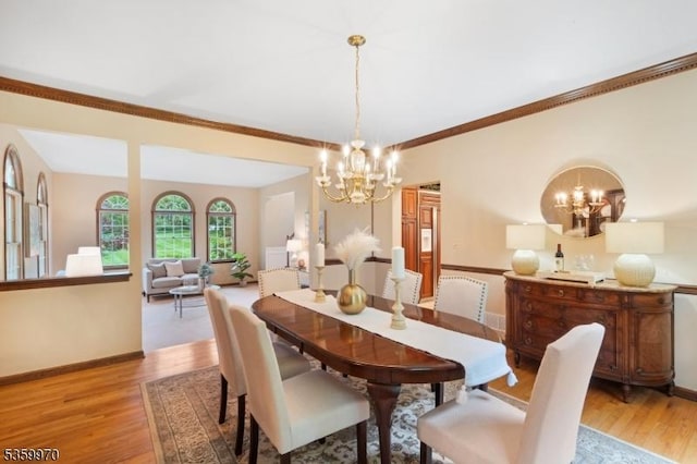 9 Oakridge Rd, Clinton Twp, NJ 08801 - dining area featuring a chandelier, light wood-style floors, baseboards, and crown molding