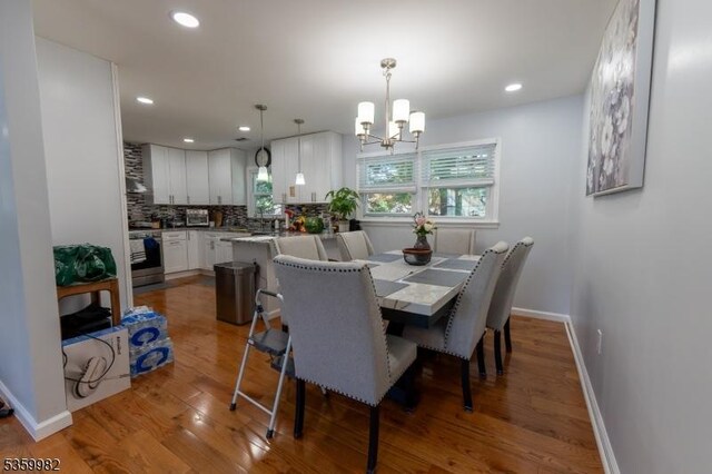 128 Jay Pl, Middlesex Boro, NJ 08846 - dining space with a chandelier, wood finished floors, baseboards, and recessed lighting