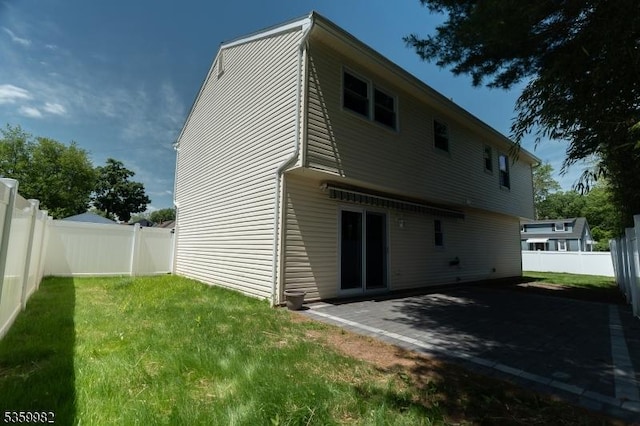 128 Jay Pl, Middlesex Boro, NJ 08846 - rear view of house with a patio