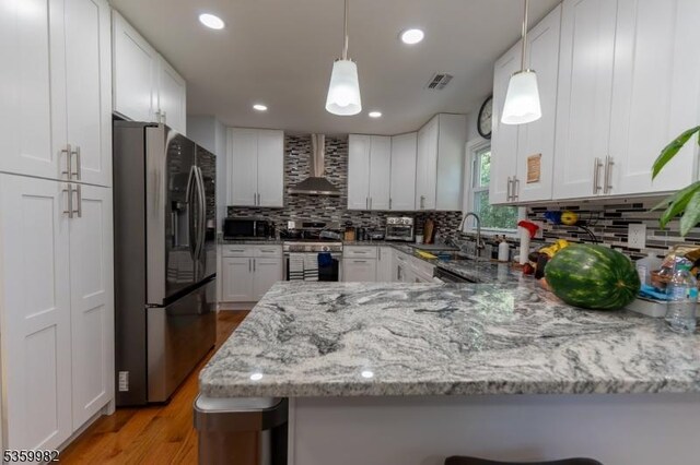 128 Jay Pl, Middlesex Boro, NJ 08846 - kitchen with refrigerator with ice dispenser, wall chimney range hood, stainless steel stove, a sink, and tasteful backsplash