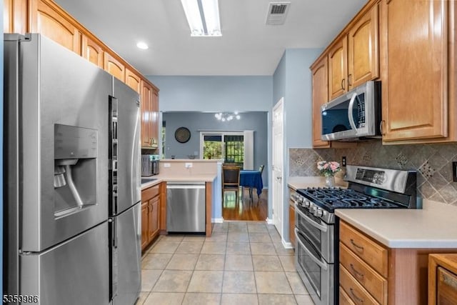 3 River Birch Cir, Montgomery Twp, NJ 08540 - kitchen featuring stainless steel appliances, backsplash, light countertops, a peninsula, and recessed lighting