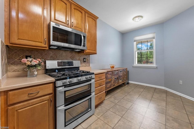 3 River Birch Cir, Montgomery Twp, NJ 08540 - kitchen featuring appliances with stainless steel finishes, backsplash, light countertops, and baseboards
