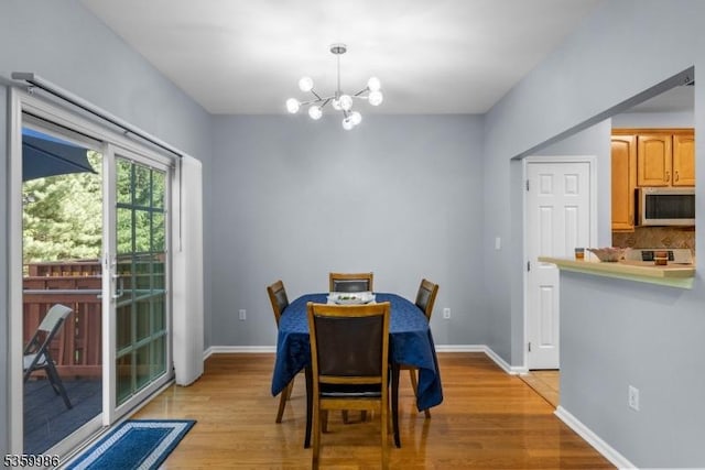 3 River Birch Cir, Montgomery Twp, NJ 08540 - dining room with a chandelier, light wood-style floors, and baseboards