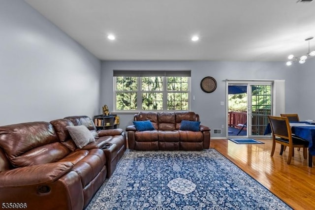 3 River Birch Cir, Montgomery Twp, NJ 08540 - living room with healthy amount of natural light, wood finished floors, recessed lighting, and a chandelier