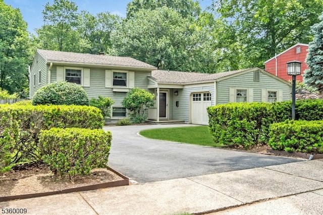 47 Drake Rd, Franklin Twp, NJ 08873 - tri-level home featuring driveway and a garage