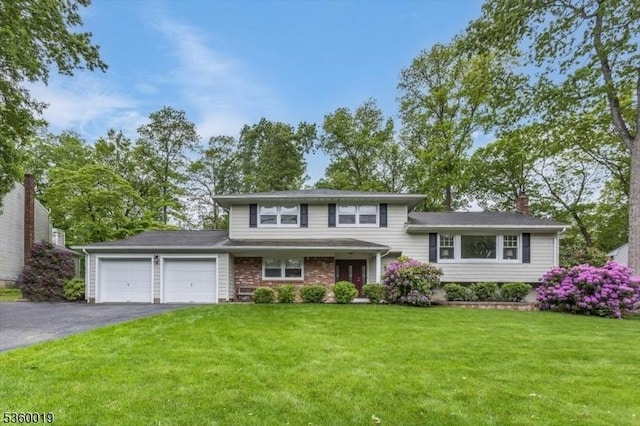 18 W Circuit Dr, Roxbury Twp, NJ 07876 - split level home with an attached garage, asphalt driveway, a front lawn, and a chimney