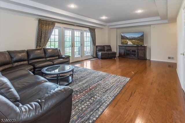 22 Troon Dr, Fredon Twp, NJ 07860 - living room featuring wood finished floors, french doors, a raised ceiling, and recessed lighting