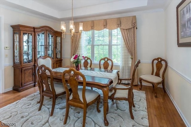 22 Troon Dr, Fredon Twp, NJ 07860 - dining room featuring a chandelier, light wood-type flooring, a tray ceiling, crown molding, and baseboards