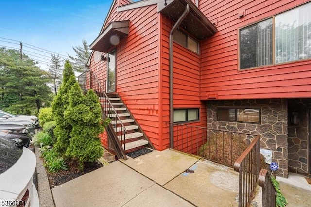 101 River Rd Unit C2, Nutley Twp, NJ 07110 - view of side of property featuring stone siding and stairway