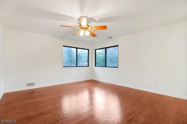 101 River Rd Unit C2, Nutley Twp, NJ 07110 - empty room with ceiling fan, wood finished floors, and baseboards