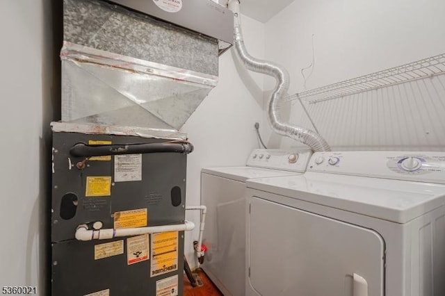 101 River Rd Unit C2, Nutley Twp, NJ 07110 - laundry area with washing machine and clothes dryer and heating unit