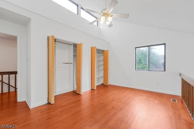 101 River Rd Unit C2, Nutley Twp, NJ 07110 - unfurnished bedroom with light wood-style floors, baseboards, multiple closets, ceiling fan, and lofted ceiling