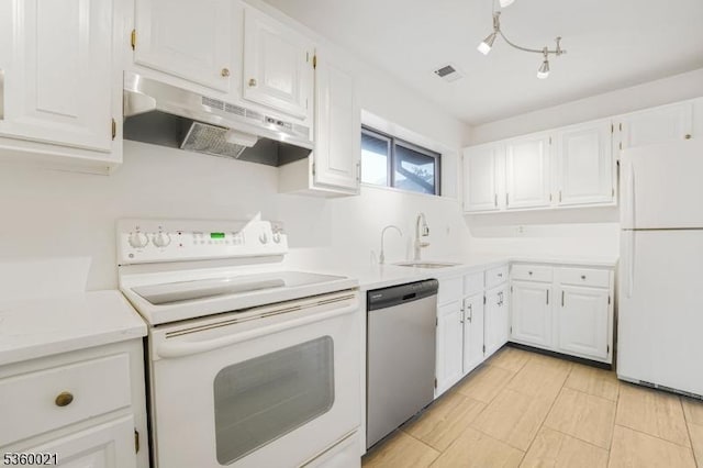 101 River Rd Unit C2, Nutley Twp, NJ 07110 - kitchen with white appliances, under cabinet range hood, a sink, and white cabinetry