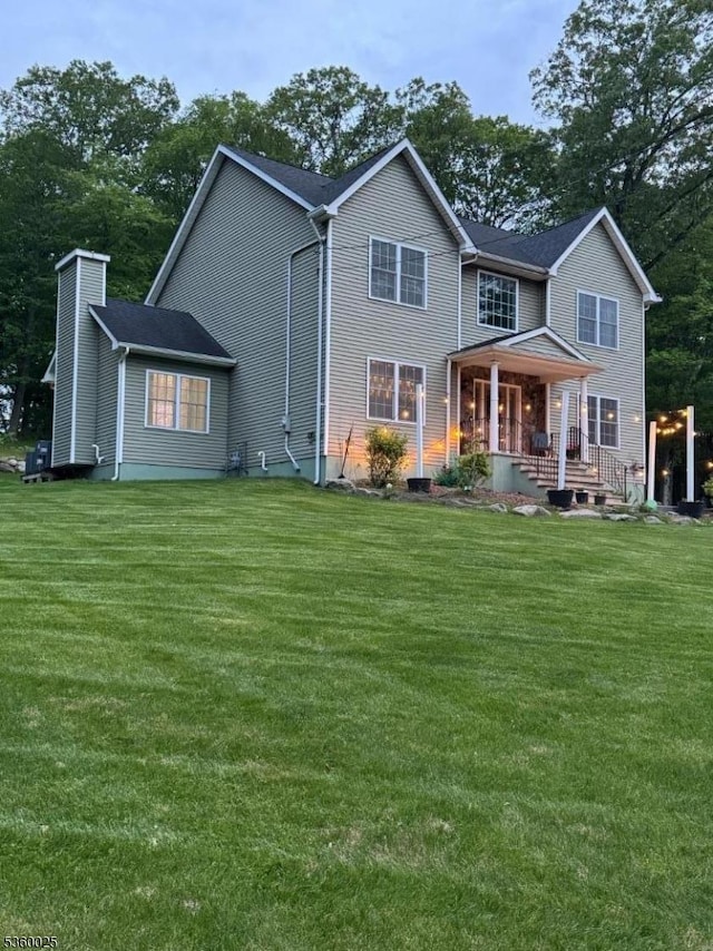 275 Park Rd, Parsippany-Troy Hills Twp, NJ 07054 - rear view of property with covered porch and a yard