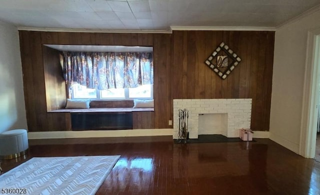 152 Ivy St, Newark City, NJ 07106 - living area featuring baseboards, wood finished floors, a fireplace, crown molding, and wood walls