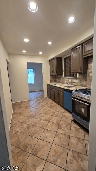 152 Ivy St, Newark City, NJ 07106 - kitchen with stainless steel range with gas cooktop, dishwasher, decorative backsplash, light countertops, and recessed lighting