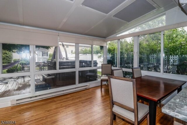 6 Maple Ave, West Orange Twp, NJ 07052 - sunroom / solarium featuring baseboard heating, hardwood / wood-style flooring, vaulted ceiling, healthy amount of natural light, and a wooden deck