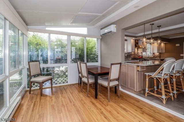 6 Maple Ave, West Orange Twp, NJ 07052 - dining space with a baseboard radiator, an AC wall unit, light wood-style floors, and plenty of natural light