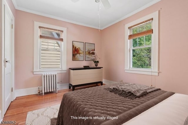 139 S Maple Ave, Springfield Twp, NJ 07081 - bedroom featuring radiator heating unit, light wood-type flooring, ornamental molding, and baseboards
