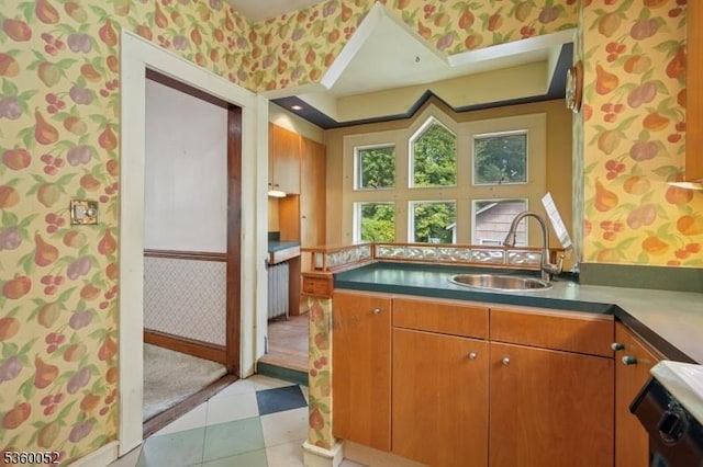 139 S Maple Ave, Springfield Twp, NJ 07081 - kitchen featuring wallpapered walls, a sink, range, a peninsula, and brown cabinetry
