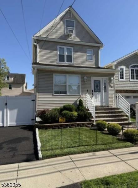 284 W Webster Ave, Roselle Park Boro, NJ 07204 - american foursquare style home with a gate and a garage