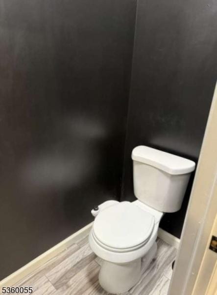 284 W Webster Ave, Roselle Park Boro, NJ 07204 - bathroom with toilet, wood finished floors, and baseboards