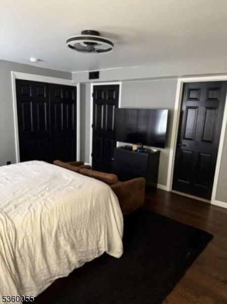 284 W Webster Ave, Roselle Park Boro, NJ 07204 - bedroom with dark wood-type flooring and baseboards