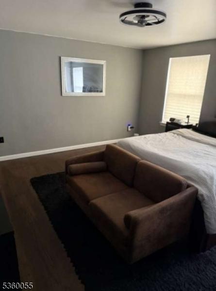 284 W Webster Ave, Roselle Park Boro, NJ 07204 - bedroom with baseboards and wood finished floors