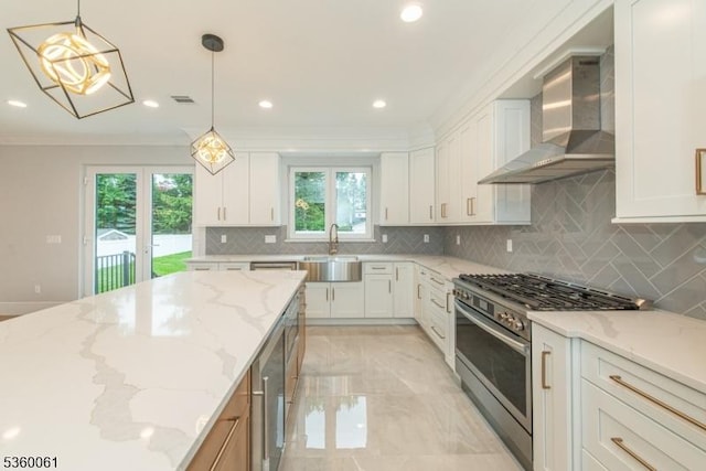 56B Jefferson Ave, Emerson Boro, NJ 07630 - kitchen featuring wall chimney exhaust hood, high end range, a sink, tasteful backsplash, and white cabinetry