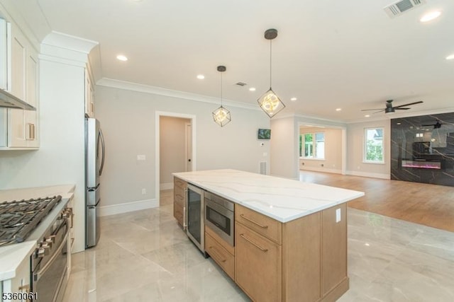 56B Jefferson Ave, Emerson Boro, NJ 07630 - kitchen with ornamental molding, a kitchen island, appliances with stainless steel finishes, wine cooler, and a ceiling fan